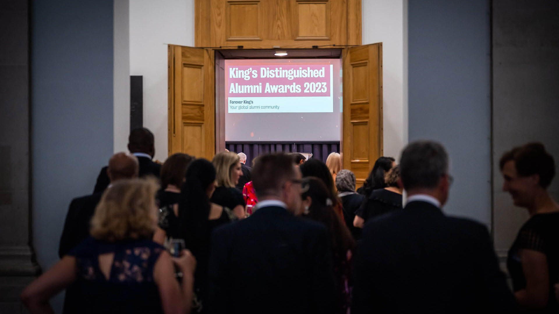 Guests in formal wear gathering at the 2023 King's Distinguished Alumni Awards ceremony